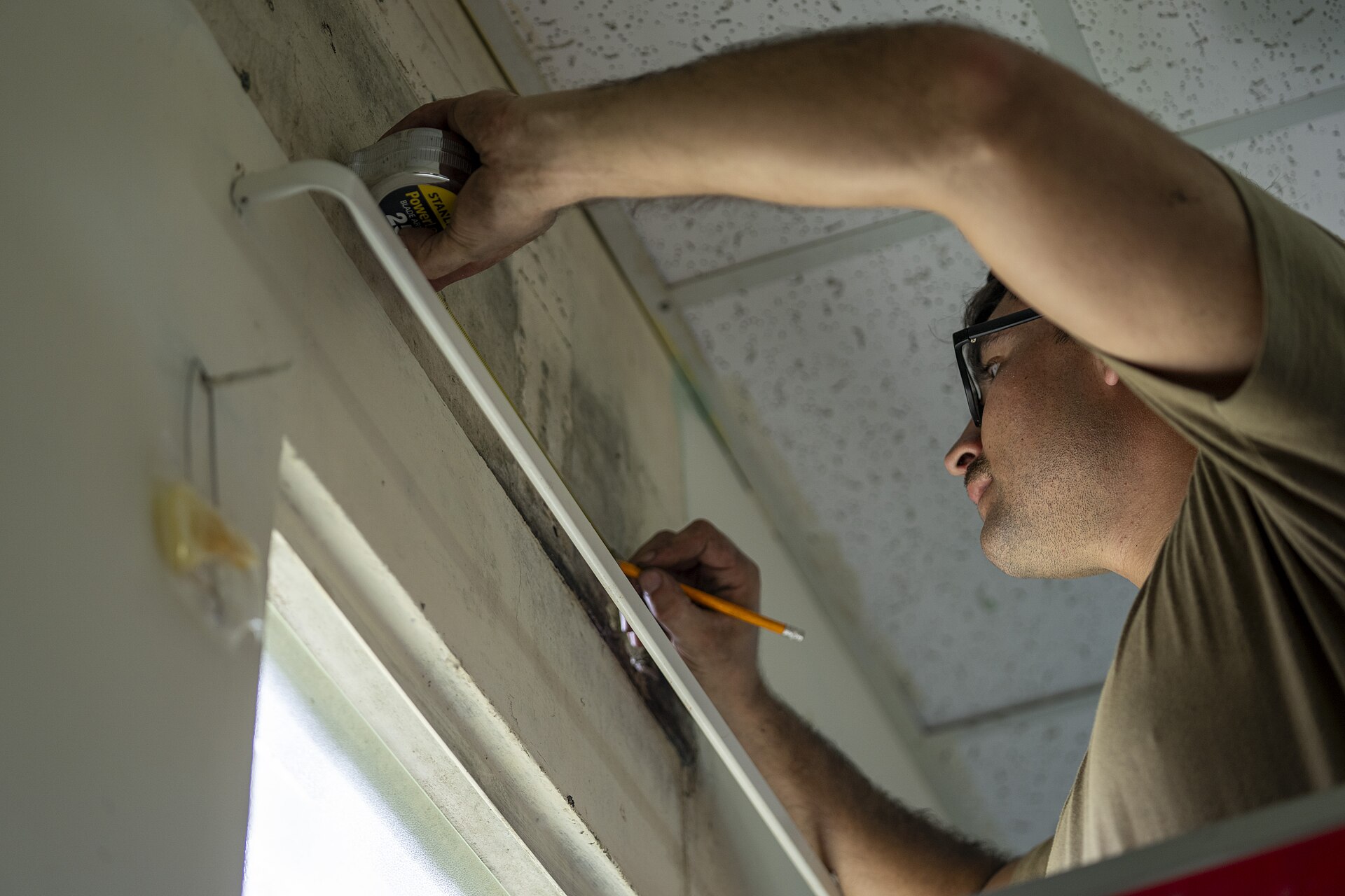 HVAC technicians working on installed mechanical equipment